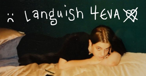 A real photo from the 1990s, Amandoll, age 15, lies atop a bed looking morose and/or unimpressed. Above her is written " frown face, languish 4 eva, heart with an X through it."