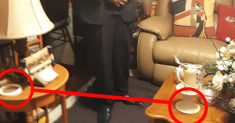 Another closer look at the larger image, but a... coaster? Is circled in red and attached to another red circle, which is encircling the bottom of a candle holder. Both of the things circles are similarly oval and white-ish. But they are different things completely.