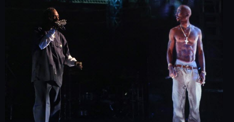 A cropped photo from the internet search engine that shows Snoop Dogg performing next to a kindly looking hologram of Tupac Shakur.